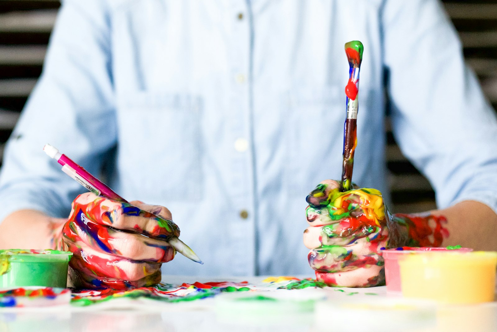 Man holds a painted mess